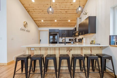 The kitchen is fully stocked and ready for group meals — plus seating for seven at the island, so everyone can stay connected while you cook.