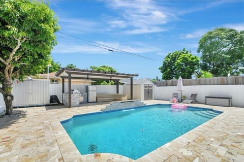 Beautiful relaxing backyard with outdoor grill.