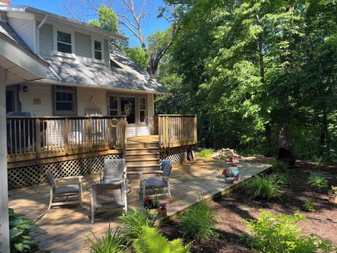 Twin level decks in back overlooking secluded garden.