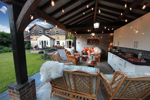 Sip cocktails in our fairy-lit pergola and BBQ area & listen to the birds sing!