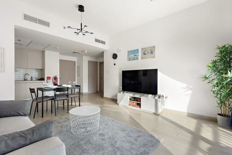 Living Room: Bright and airy space with sleek decor, perfect for relaxing after a day of adventure!