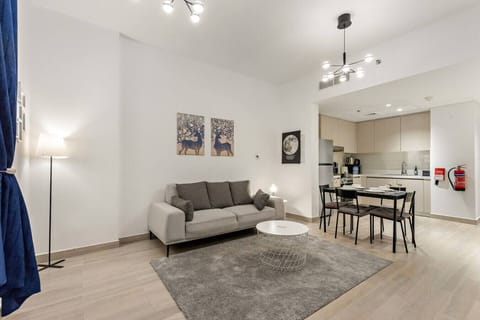 Living Room: Bright, modern space perfect for relaxation with artful decor and plush seating.