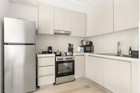 Modern Kitchen: Sleek appliances and ample space make meal prep a delight in this stylish kitchen!
