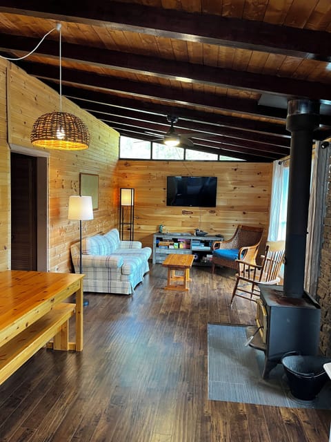 Living room with wood fire place and a variety of board games.