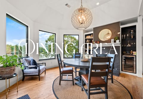 Natural light floods this cozy dining nook, perfect for morning coffee, intimate dinners, or game night with friends and family alike.