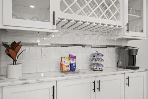 Coffee & Snack Bar | Glass Cabinetry, Wine Storage, and Coffee Station with Treats