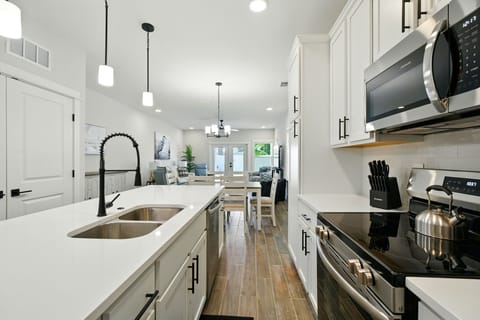 Open concept kitchen to dining and living room areas