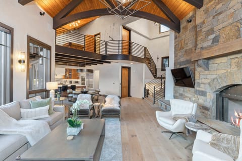 Living room area overlooking the back of the home with access to the other floors