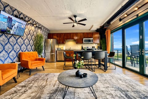 Open Living & Kitchen Space
Enjoy a bright, open layout with a full kitchen, cozy seating, and sliding doors leading to a private patio with lake views.