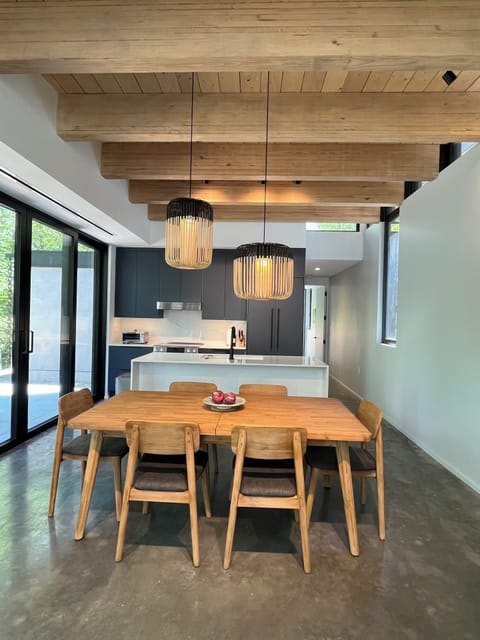 Dining table with kitchen in background