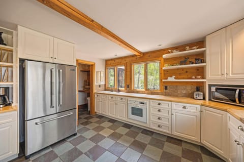 Kitchen: Main floor, Dacor oven, Jenn-Air fridge, drip coffee maker, French press, blender, toaster oven, food processor, cooking utensils, tableware