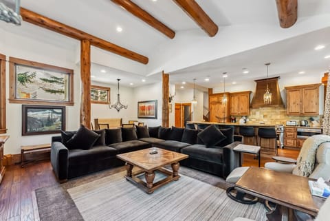 Living room: Main floor, wood-burning fireplace, Smart TV, Sonos speaker, deck access