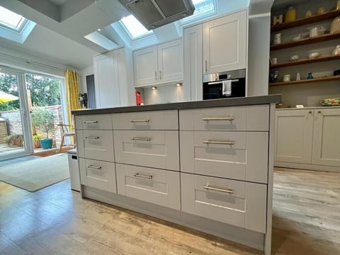 Island counter, which contains all necessary kitchen equips