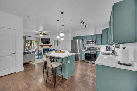 Kitchen: Main floor, drip coffee maker, Keurig, toaster, cooking utensils, tableware