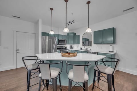 Dining area: Main floor, table seating for 4, 4 barstools at island