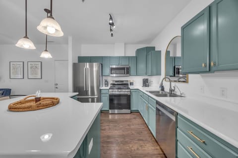 Kitchen: Main floor, drip coffee maker, Keurig, toaster, cooking utensils, tableware