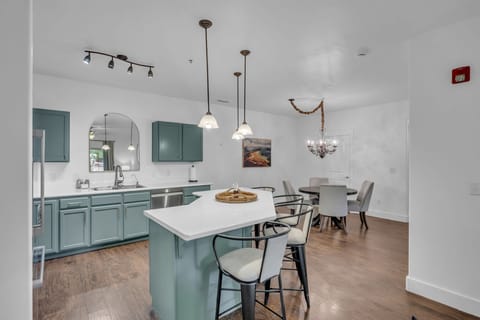 Kitchen: Main floor, drip coffee maker, Keurig, toaster, cooking utensils, tableware