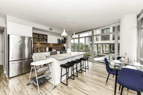 Fully equipped kitchen with a breakfast counter (seats 3) and a dining area (seats 4), plus a high chair available for little ones.