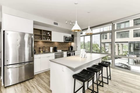 Fully equipped kitchen with a breakfast counter (seats 3) and a dining area (seats 4), plus a high chair available for little ones.