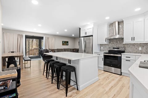 Cook up a feast in this spacious kitchen with island seating for four