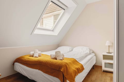 A bright sleeping nook featuring a comfy bed and a soft, warm blanket for added comfort.