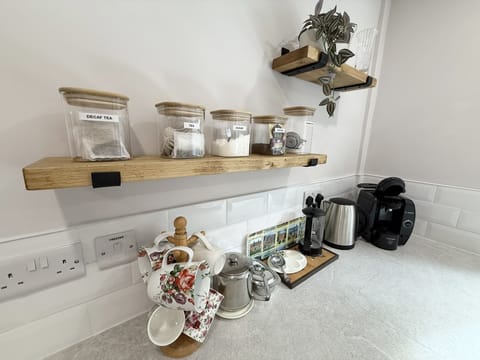 Tea and coffee making area including coffee machine