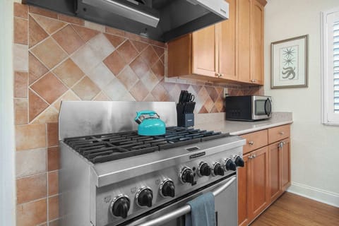 Cook up a feast in this stylish kitchen with modern appliances and charming decor.