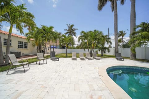 Relax by the private pool in this tropical oasis, complete with palm trees and ample lounge seating.
