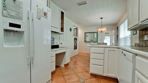 Fully stocked kitchen with dishwasher.