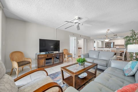 Spacious living room w/ comfy seating, TV, and easy flow into the dining area for relaxed gatherings.