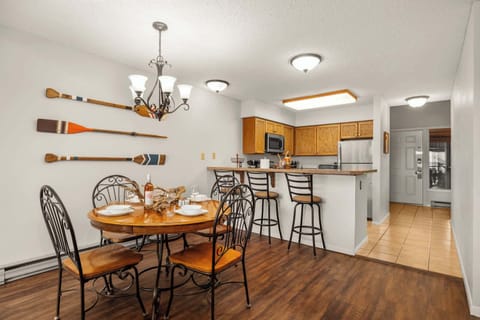 Gather around for meals or game night in the cozy dining nook with lake cabin charm.