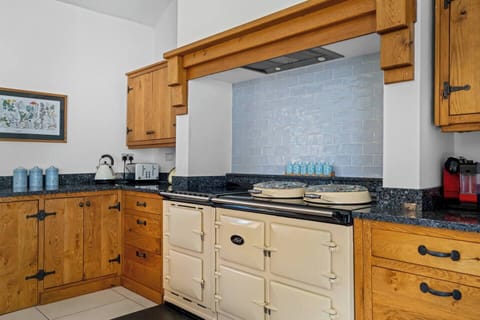 A beautiful Aga but fear not!... the left hand over and hobs is entirely electric and super easy to use! Coffee machine, kettle, toaster, fridge and generous storage space. Fully equipped with all you need to cook up a treat! 