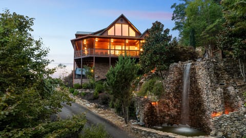 Waterfall Lodge perched above its namesake cascade at golden hour