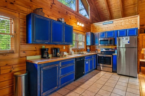 Cook like home in the fully stocked kitchen featuring modern appliances