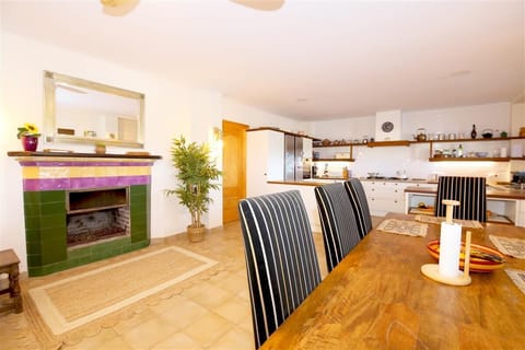 Another view of the lounge with dining area and open kitchen to the rear