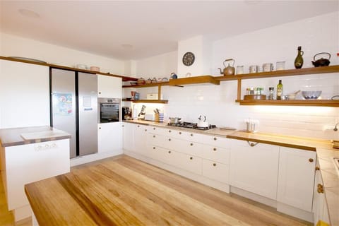 Open kitchen is fully equipped with all the appliances