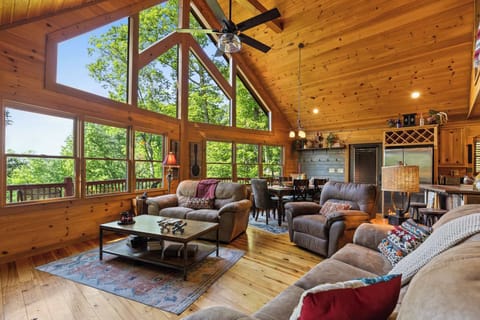 Our large plush sofa is made for comfort and connection, all in a spacious open floor plan perfect for family gatherings, movie nights, or a peaceful nap after a day of mountain adventures.