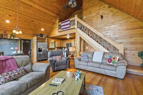 Our large plush sofa is made for comfort and connection, all in a spacious open floor plan perfect for family gatherings, movie nights, or a peaceful nap after a day of mountain adventures.