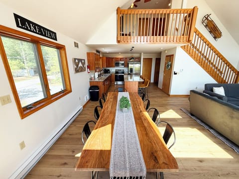 Large dining table sits just off the kitchen, making meal serving a breeze.
