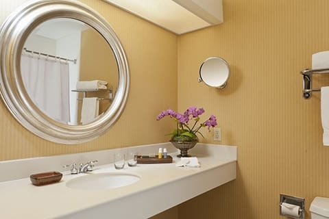 Ease into your routine with a clean vanity and soft lighting.