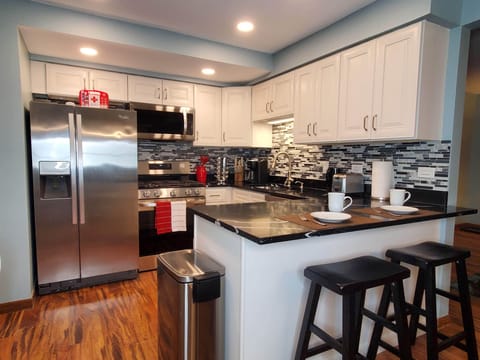 Full kitchen with all the amenities you need for a comfortable stay.