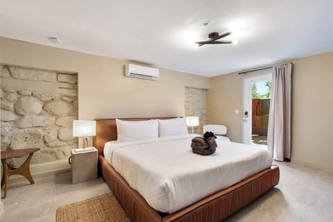 King Bed, stone accent walls.