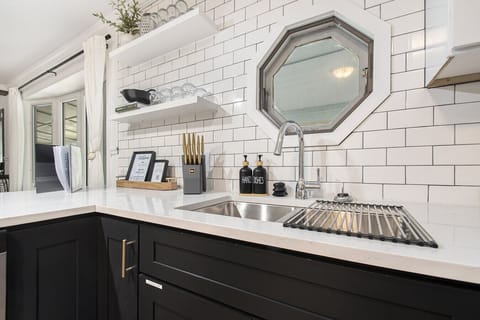 Kitchen is stocked with pots, pans, dishes, silverware, dish soap, dish towels, etc. We also provide kids` dishes and utensils.