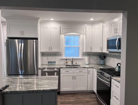 Remodeled kitchen with clean, coastal style.