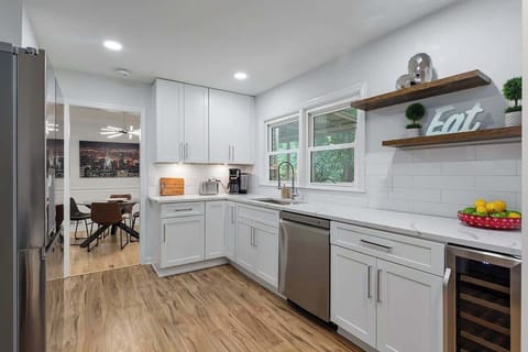 Modern Appliances: The kitchen features sleek, stainless steel appliances, including a state-of-the-art oven and microwave, ensuring a convenient cooking experience.