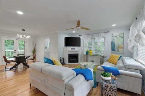 Bright and Airy Living Space: The open-concept design allows natural light to flow seamlessly through the space, enhancing the airy ambiance.