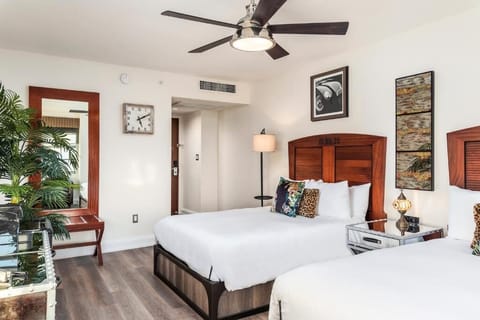 Settle into crisp linens and a spacious, airy bedroom retreat.