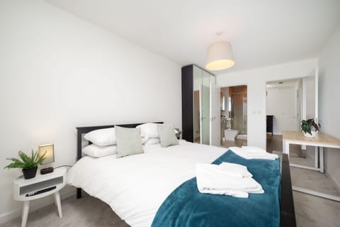 A spacious retreat featuring a king size bed that offers comfort and plenty of room to relax.