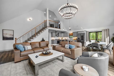 The open floor plan connects the living room, dining area, and kitchen seamlessly.