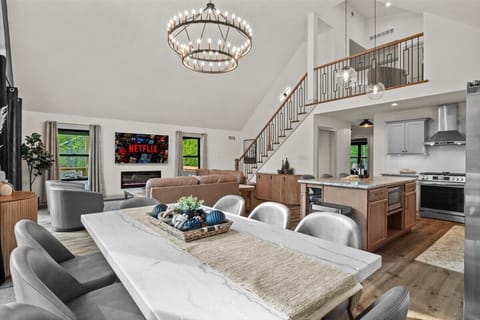 Stream your favorites on the smart TV beside the electric fireplace.